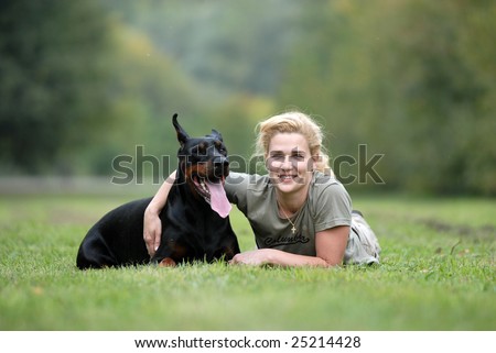 Similar – Pretty blond woman with her two dogs