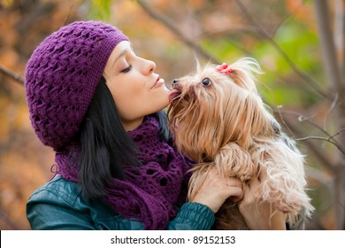 Dog In Girls Hand Lick Her Chin