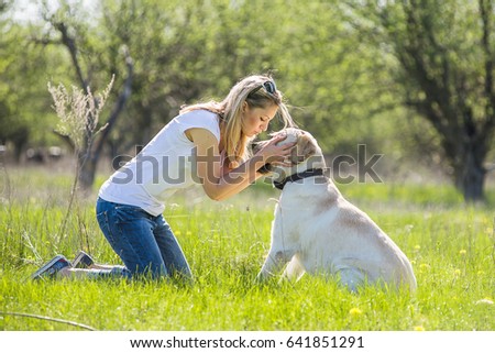 Similar – Happy smiling dog with its pretty young owner