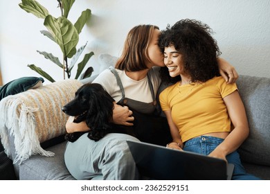 Dog, laptop or gay couple kiss on sofa to relax together in healthy relationship love connection. Whisper, home or happy lesbian women with a pet animal to bond on living room couch for remote work - Powered by Shutterstock