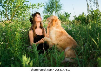 The Dog Is Man's Friend. The Attitude Of A Person To A Dog. Golden Retriever