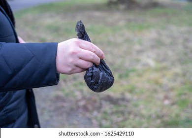 Dog Poo Poop Bag Holding In The Hand