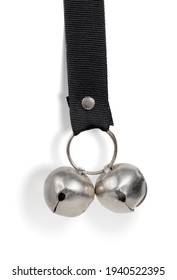 Dog Potty Bell Or Dog Training Bell. Used For House Train Puppies Or Dogs. Dog Will Ring Bell To Do The Business Outside. Two Silver Bells On A Black Strap. Isolated On White. 