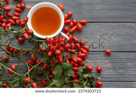 Dog rose with bunch branch Rosehips, types Rosa canina hips and herbal tea composition. 