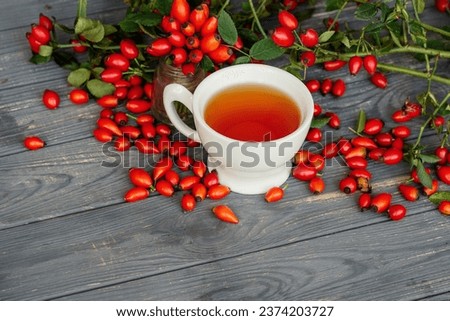 Dog rose with bunch branch Rosehips, types Rosa canina hips and herbal tea composition. 