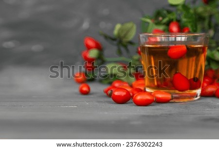 Dog rose with bunch branch Rosehips, types Rosa canina hips and herbal tea composition.	