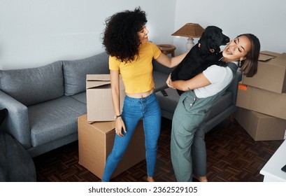 Dog, smile and gay couple in new home, play and bonding together in living room. Happy lesbian women with pet in house, apartment and moving in to real estate property, having fun and carrying animal - Powered by Shutterstock