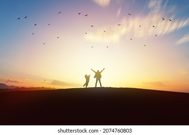 Dog Standing With Owner At Beautiful Sunset, New Year Concept.