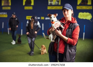 Dog Trainer And A Cute Puppy Posing For The Camera