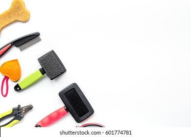 Dog Training And Care Concept With Toys And Grooming Tools On White Table Background Top View Mock Up