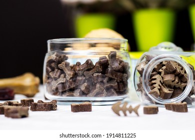 Dog Treats Spilling Out Of Bowl. Dog Treats And Biscuits