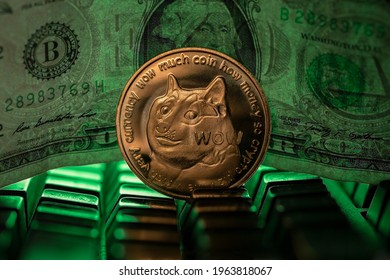 Doge cryptocurrency physical coin placed next to US dollar in the dark background and lit with green light