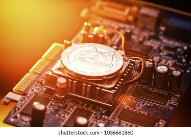 Dogecoin doge Cryptocurrency coin on a PC computer graphic card, crypto currency mining concept 
