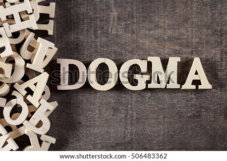DOGMA word made with wooden letters