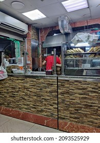 Doha, Qatar - 10 Nov 2021: Man Carving Out Shawarma At Petra Sandwich Shop In Matar Qadeem. 