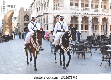 Doha, Qatar, 10th September 2019. Mounted Police Patrol The Main Thoroughfare Of Souq Waqif In Qatar With In Background The Famous 