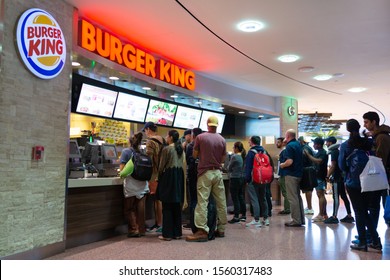 DOHA, QATAR - 31 OCT 2019: People Waiting To Order At The Counter Of Burger King Store. Burger King Claims To Serve More Than 11 Million Guests Per Day In 91 Countries And Territories Around The World