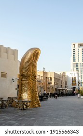 Doha, Qatar - Feb 2021: 'Le Pouce', A Sculpture In The Shape Of A Giant Thumb, Art Piece By Acclaimed French Artist César Baldaccini At Souq Waqif.