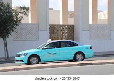 Doha, Qatar - February 06, 2019: Doha Taxi Service Known As Karwa. Vehicles Are Blue And Can Be Called By App.