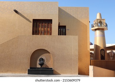 Doha, Qatar- February 08, 2019: Exterior of the Golden Masjid (Mosque) and its minaret in background, at Katara Cultural Village, Doha.