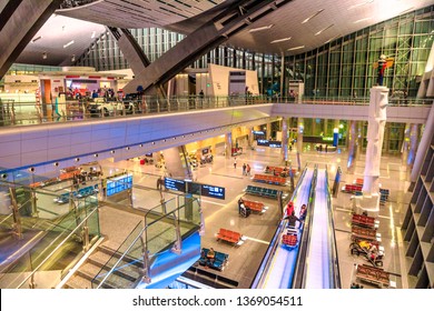 Doha, Qatar - February 24, 2019: Aerial View Of Interior Lobby And Escalator Of Hamad International Airport Or Doha Hamad Airport, The Only Airport In Qatar Open To Civilian Traffic, Opened In 2014.