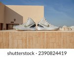 Doha, Qatar - January 1, 2017: A detailed pictue of Nike Hyperdunk Elite. A rare pair showing carbon fiber, gold and white colorway basketball shoes in VNDS condition.