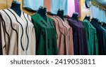 Doha, Qatar- January 10,2023: arabic women dress abaya for sale at a textile store in the souq faleh.