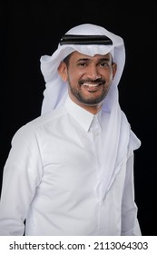 Doha, Qatar - January ,26 2022:Male model in Arab qatari dress on black background 