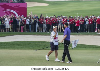 DOHA, QATAR - JANUARY 26: Chris Wood congratulated by his caddie after a magnificent eagle putt on the last hole of the US$2.5 million Commercial Bank Qatar Masters on January 26, 2013 in Doha Qatar.