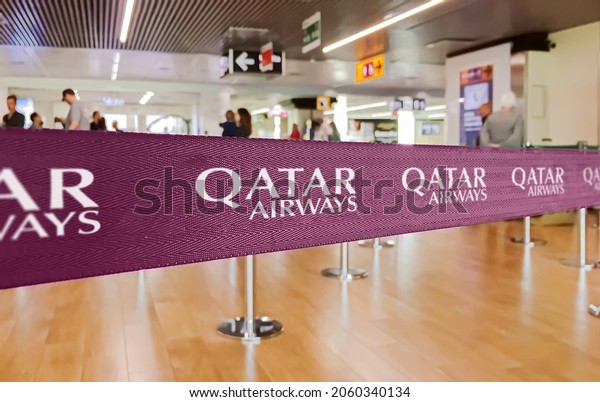 Doha, Qatar, July 2019: Purple ribbon\
barrier with the Qatar Airways airlines\
logo