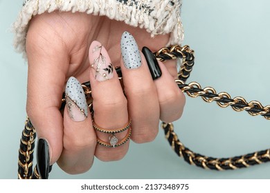 Doha, Qatar - March 10, 2022: Nail Design . Manicure Nail Paint . Beautiful Female Hand With Colorful Nail Art Design Manicure