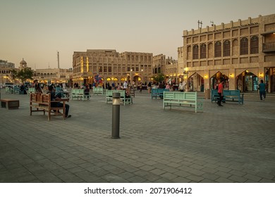 Doha, Qatar- November 7 2021: Souq Waqif  Main Street At Sunset Showing Traditional Arabic Textile Shop, Coffee Shops , Locals And Visitors Walking. Qatar Reopen After Corona Virus Pandemic 