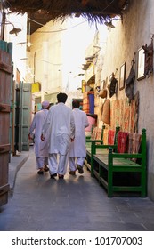 Doha, Qatar - Three Man In Local Traditional Dress In Souk Waqif