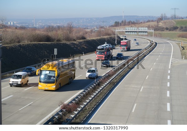 Dohna, Germany,\
02-16-2019, a view from a bridge who crosses the highway to the\
daily traffic on the A 17 who leads from Dresden to Prague, lots of\
cars and trucks on the\
way