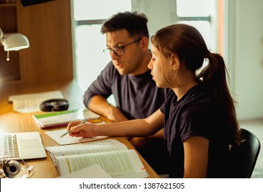 Doing homework with my Dad - Powered by Shutterstock