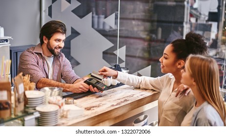 Doing Nothing For Others Is The Undoing Of Ourselves. Small Business, Payment, People And Service Concept - Woman With Credit Card Buying Coffee At Cafe Or Coffee Shop