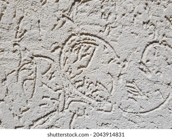 Do-it-yourself light brown decorative plaster bark beetle - with infrequent rounded squiggles
- in the sun (texture).