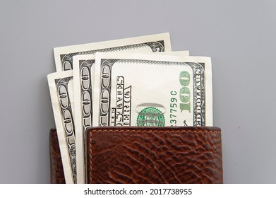 Dolars In Wallet On Gray Background