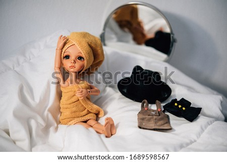 Doll in bedroom for dress up