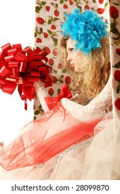 The doll in a gift box.