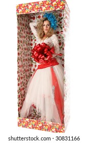 The doll in a gift box.