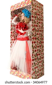 The doll in a gift box.