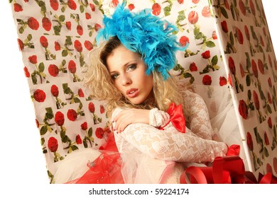 The doll in a gift box.