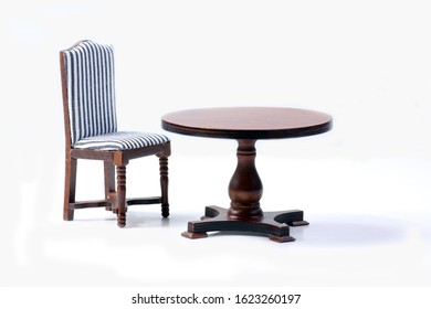 Doll House Interior - Chair And A Table Isolated On White Background. Image Contains Copy Space