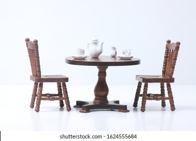 Doll House Interior - Two Chairs And A Table Served For Tea Isolated On White Background. Image Contains Copy Space