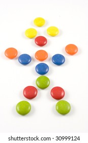 Doll Made Of Colored Smarties - Isolated Over White