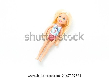Doll toy isolated on white background. Play and learn. Toy room. Kids play. Cloth doll. Girl character doll. Cute doll toy. Packshot photography. Toy design. Colourful objects. Childhood. Top view.