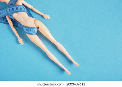 The Doll Is Wrapped With A Measuring Tape, The Cult Of Slimness And Anorexia Concept, Diet And Loss Weight