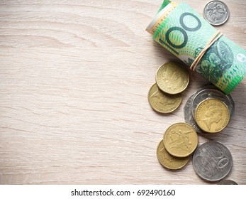 Dollar Australia Banknotes And Coins  On Wooden Table With Copy Space For Money Concept.