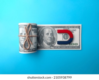 Dollar banknotes money and red blue magnet. Money laundering - Shutterstock ID 2105938799